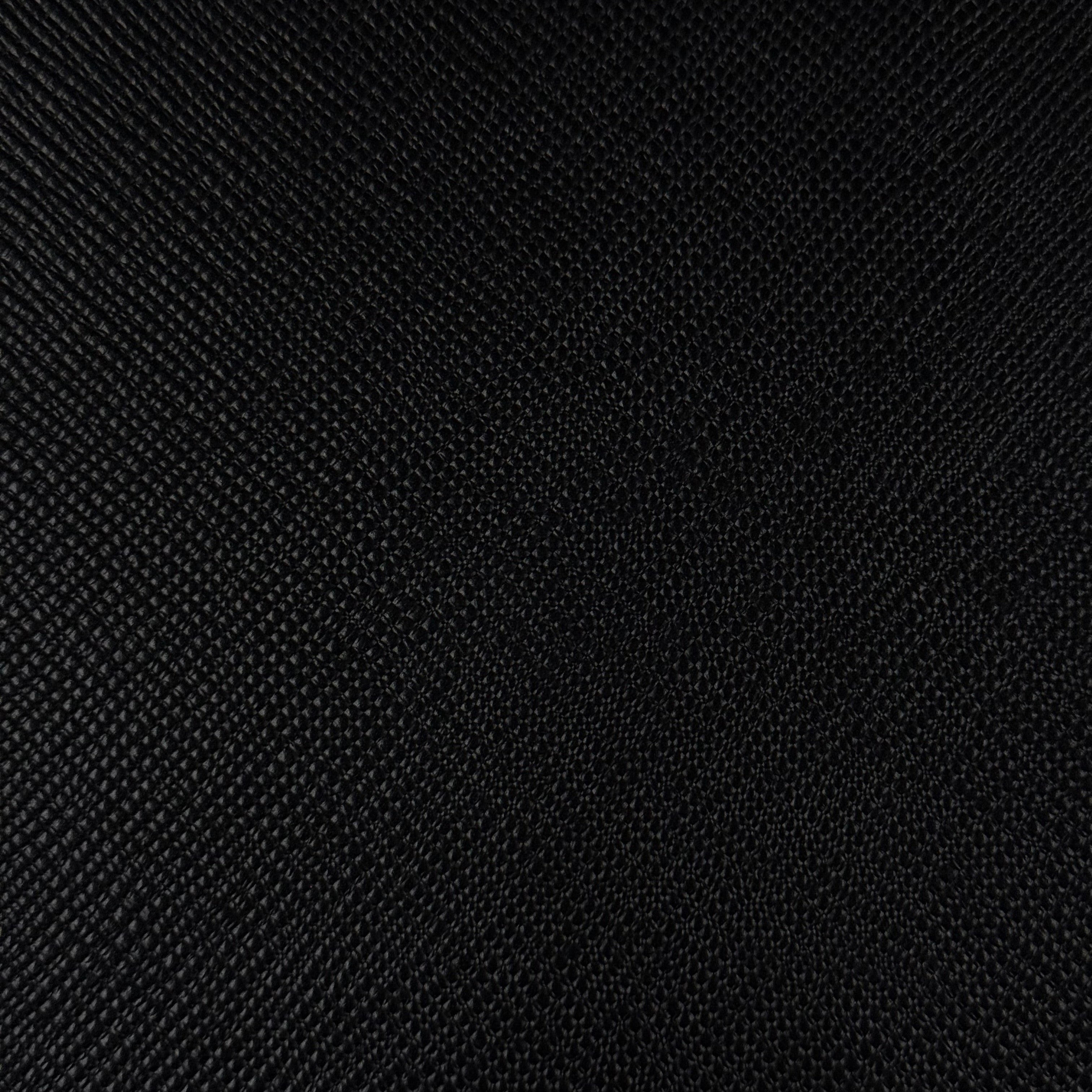 Close-up of black Conceria Walpier Hatch Buttero leather with a uniform embossed texture.