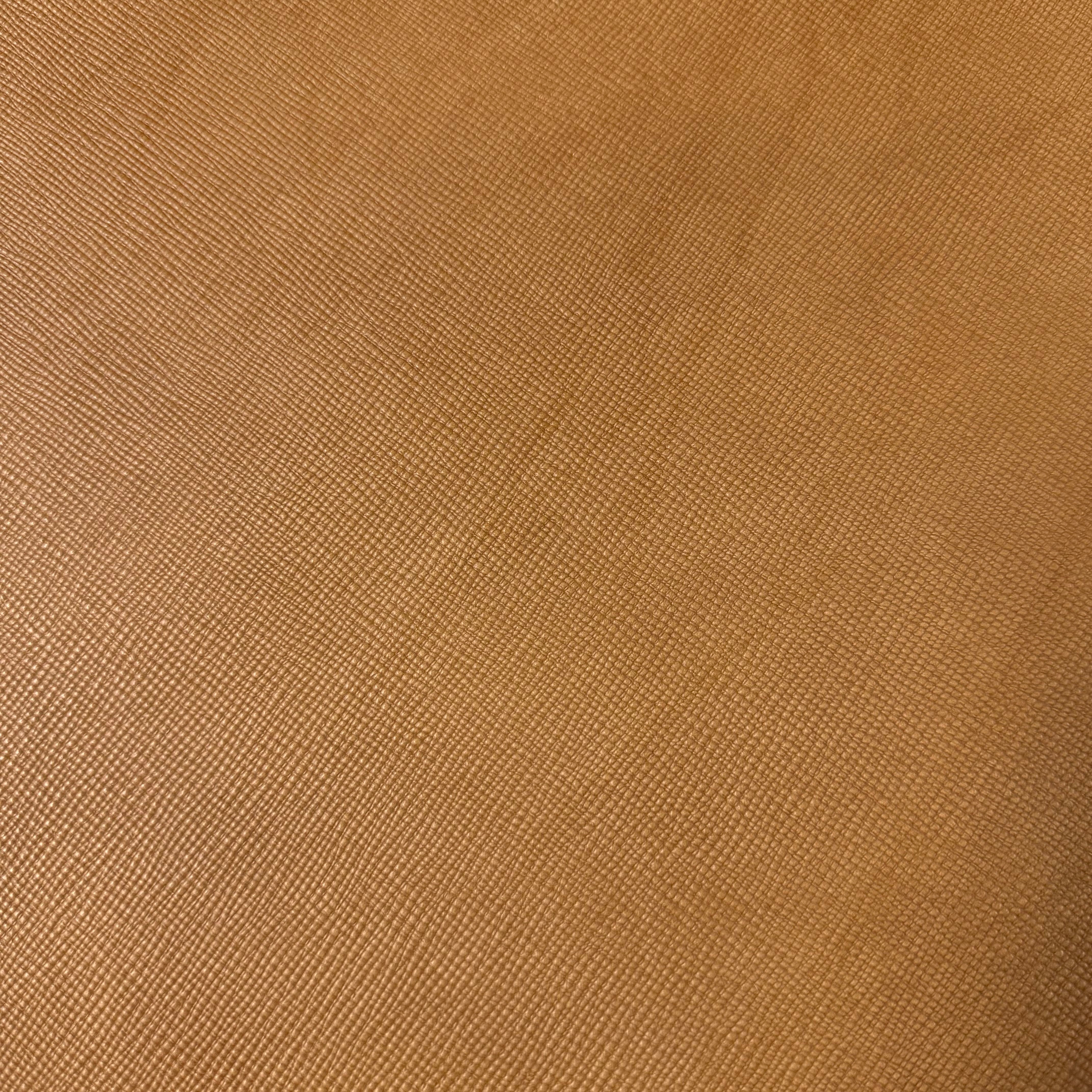 Cognac Conceria Walpier Hatch Buttero vegetable tanned cow leather with a uniform embossed texture.