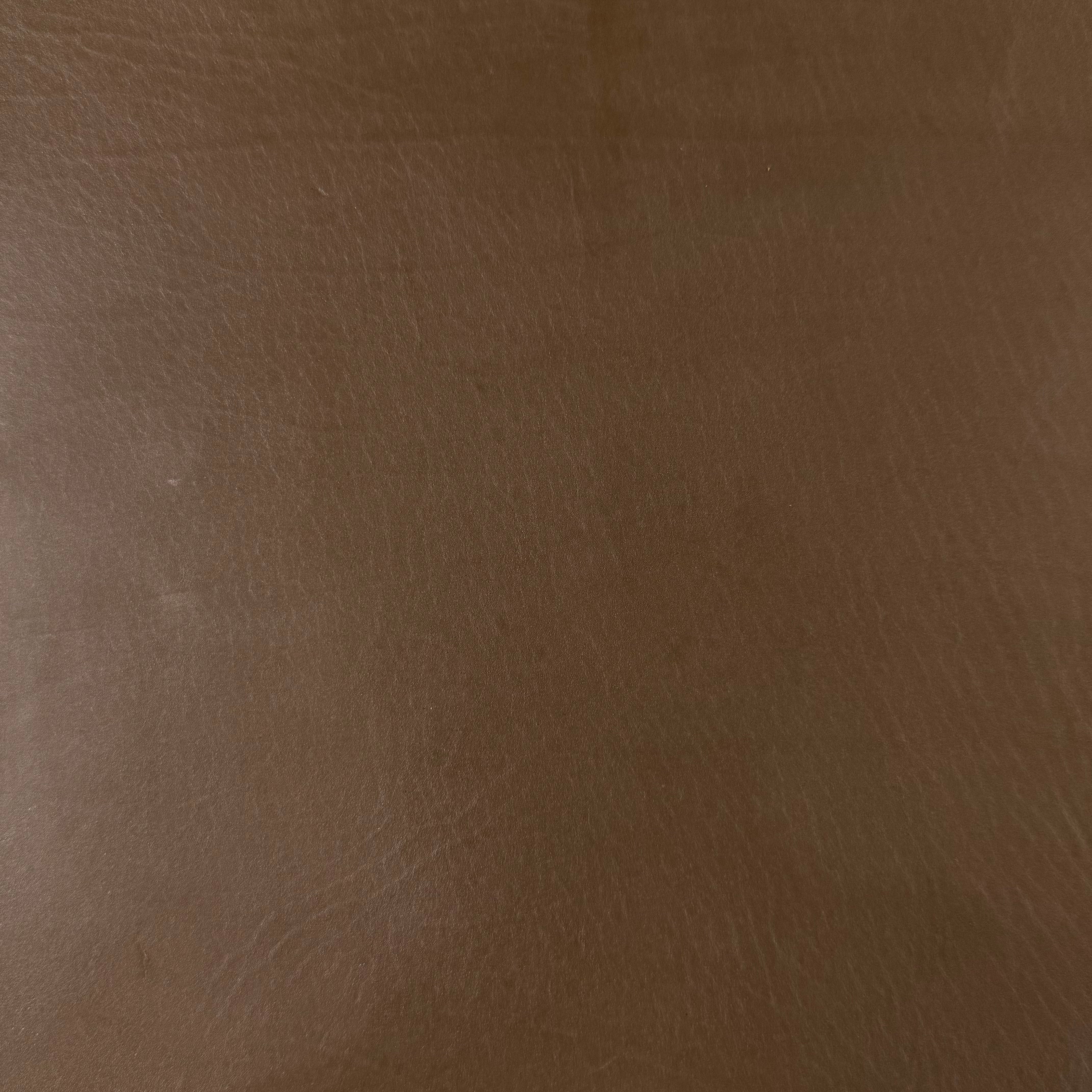 Smooth brown vegetable-tanned baby calf leather with a polished aniline finish.