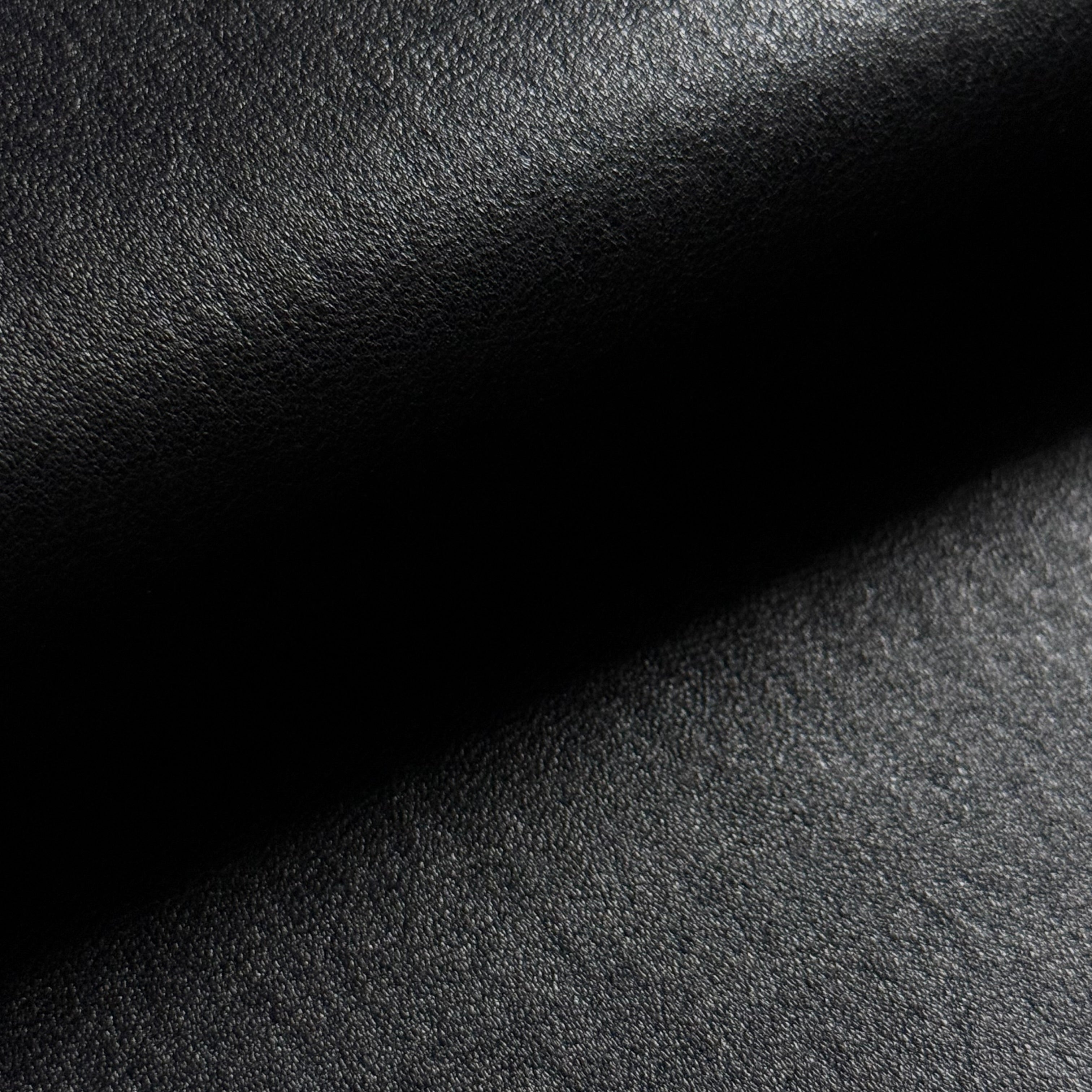 Black Italian stretch Nappa lamb leather with a smooth, semi-aniline finish and slight sheen.
