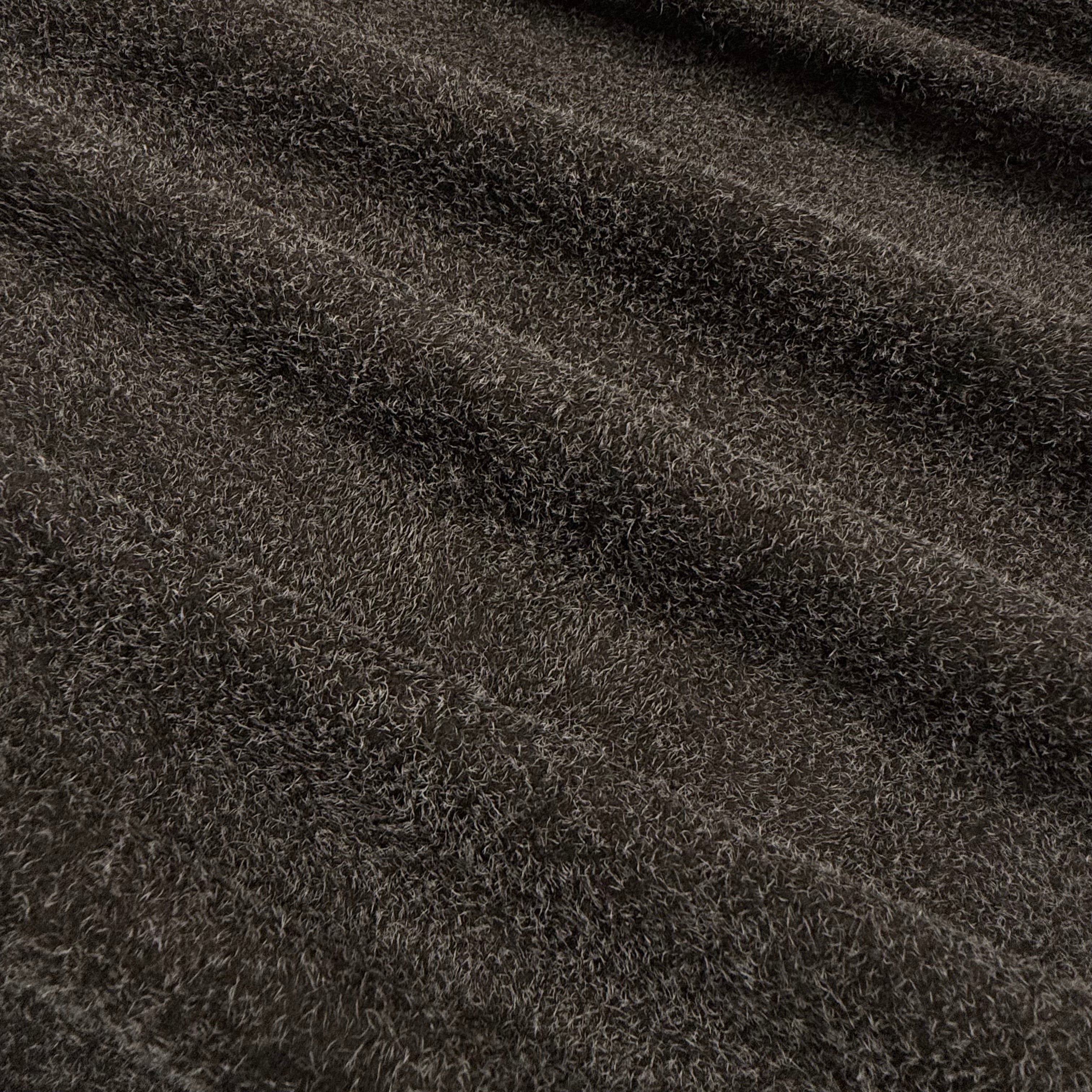 Dark brown hairy calf suede leather with a rough-out texture and long, shaggy fibers.
