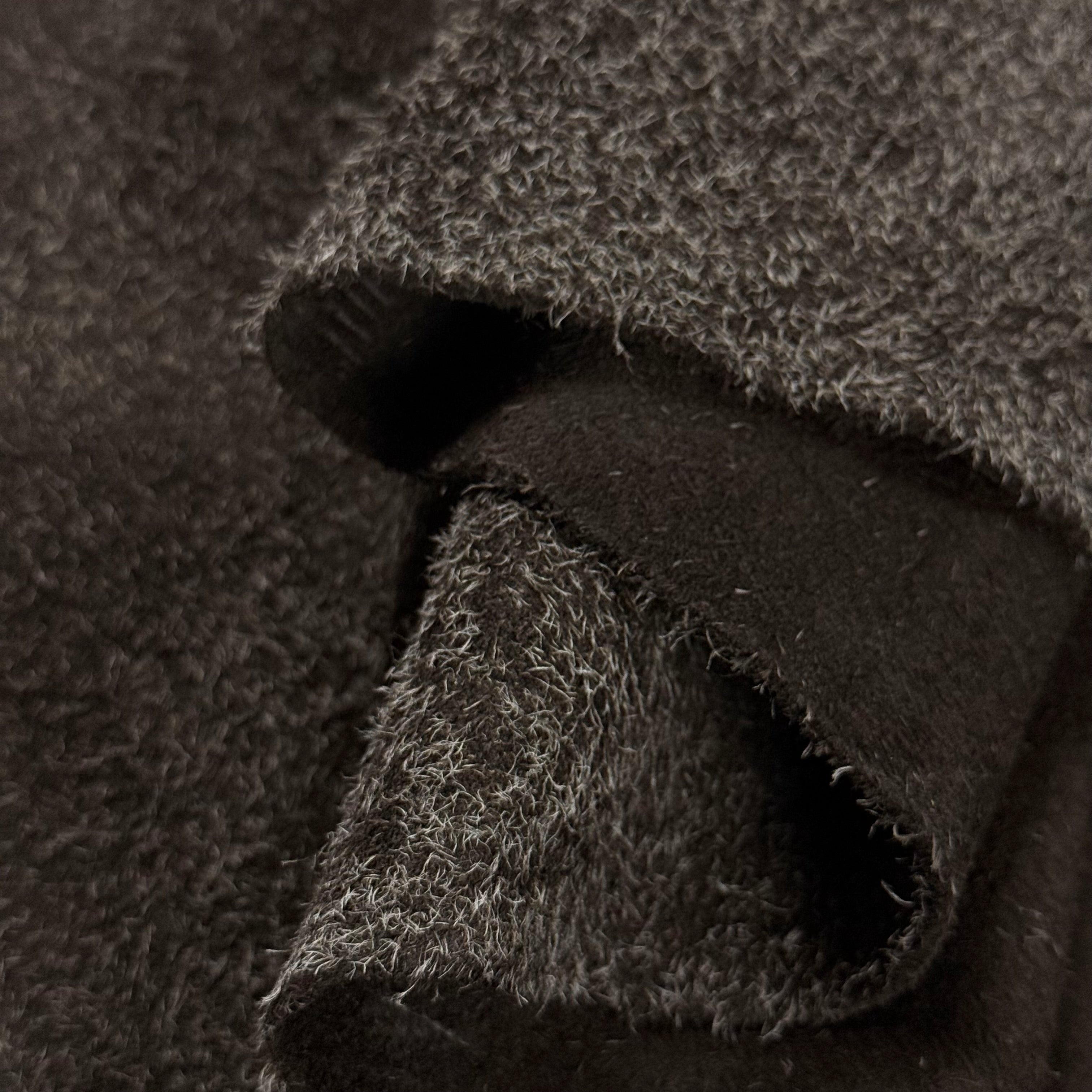 Dark brown hairy calf suede leather with contrasting long fibers and soft texture.