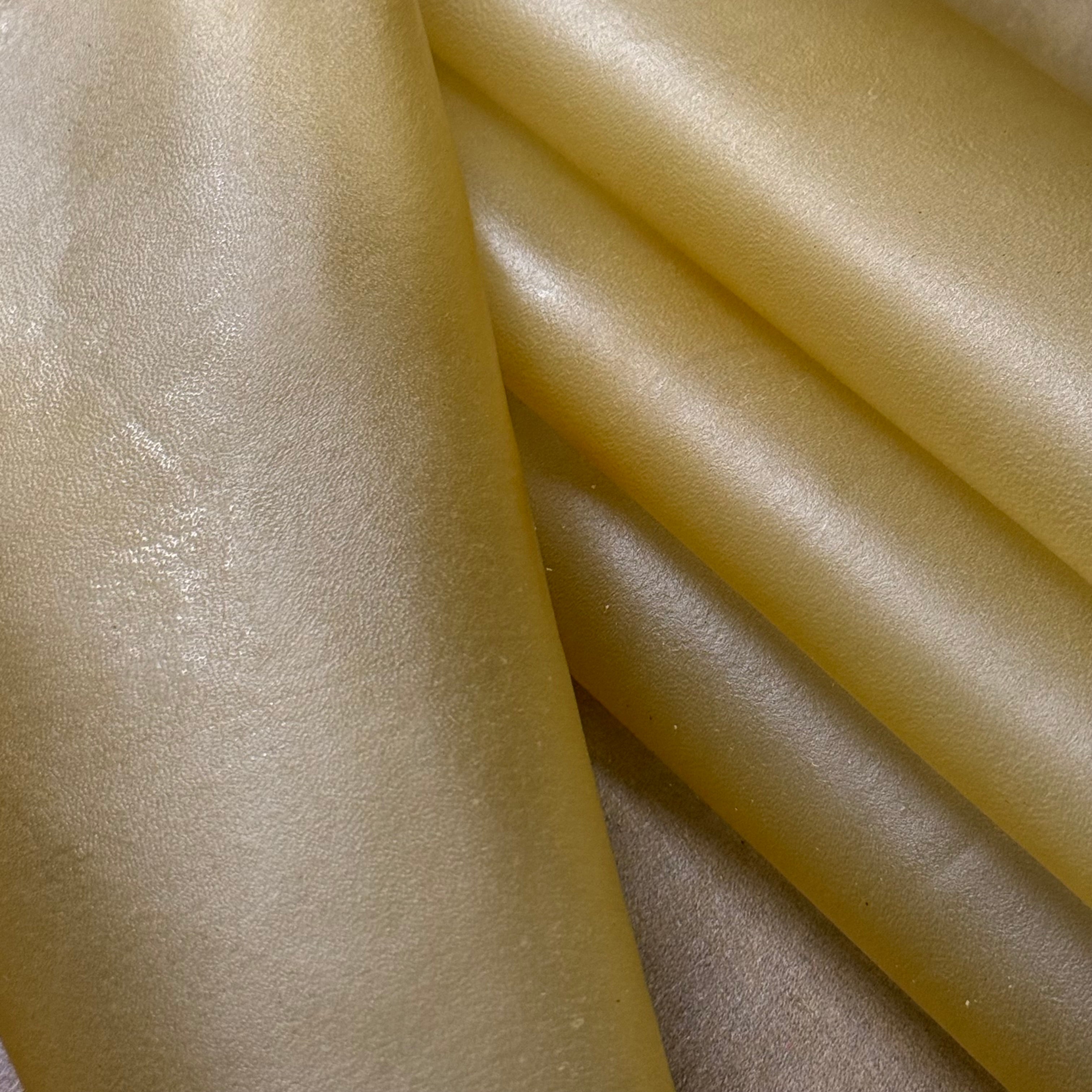 Transparent natural lamb leather, 1.5 oz, featuring a soft, translucent, and flexible texture with a smooth finish.