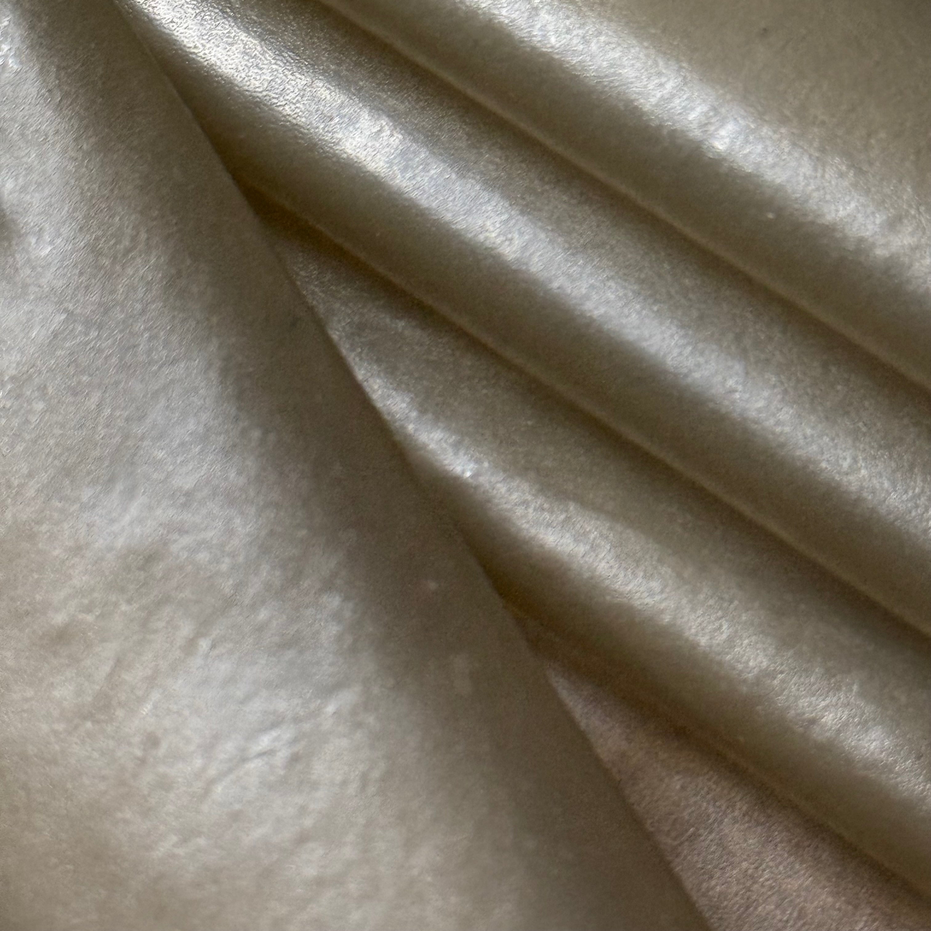 Transparent Lamb Leather in Smoke, 1.5 oz, featuring a smooth, semi-translucent finish with soft, elegant folds.