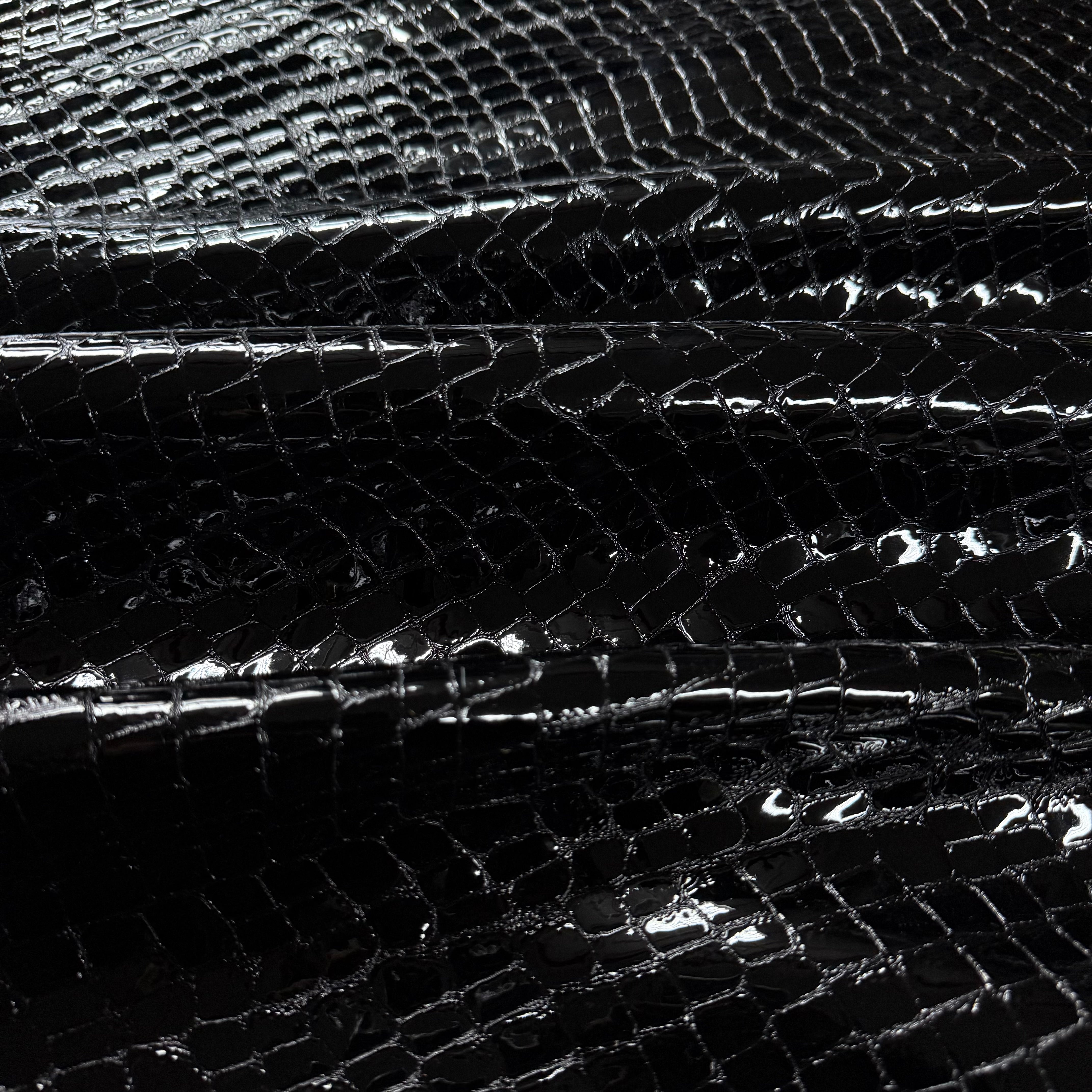Close-up of black dragon scale patent calf leather
